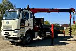 Бортовой автомобиль FAW с КМУ UMM 76 ТБ с буровой установкой